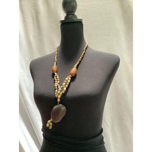 Vintage beaded necklace made of wood, stone, fabric and seeds