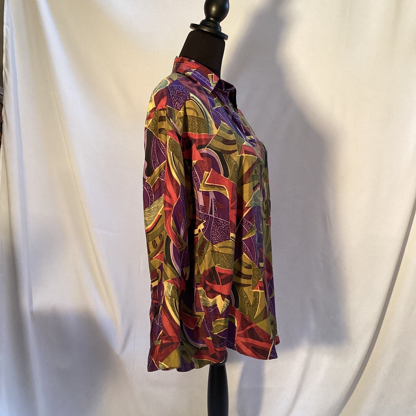 multicolored 100% silk blouse with buttons by Stint Collections. Size medium. Colors brown, green, blue