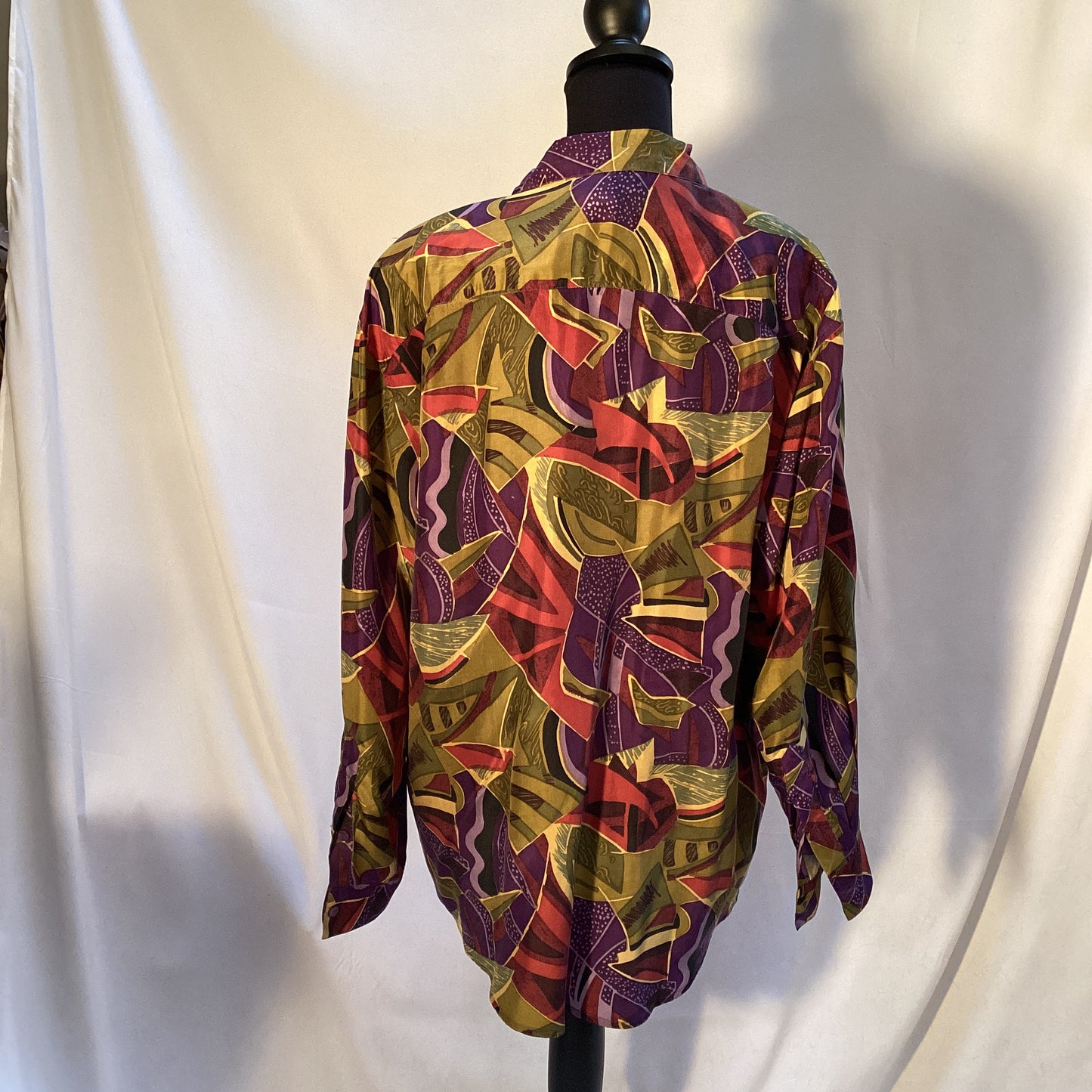 multicolored 100% silk blouse with buttons by Stint Collections. Size medium. Colors brown, green, blue