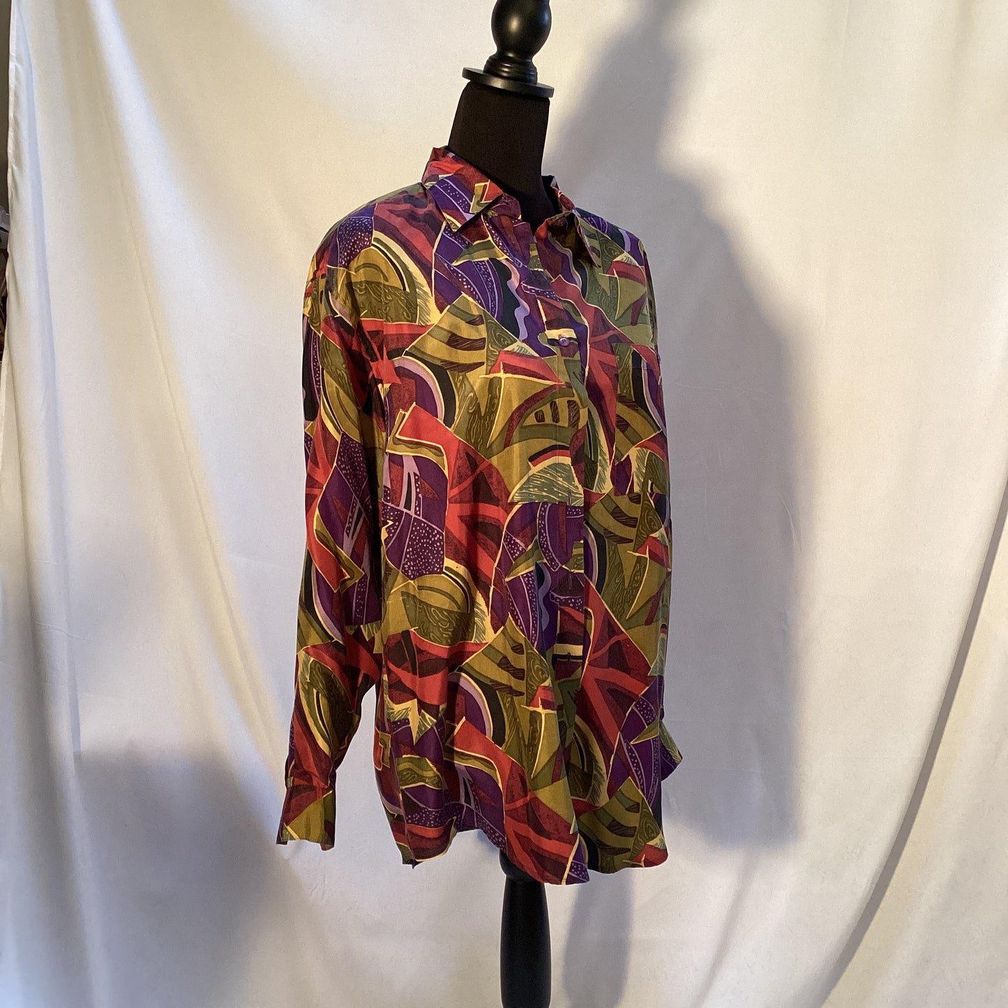 multicolored 100% silk blouse with buttons by Stint Collections. Size medium. Colors brown, green, blue