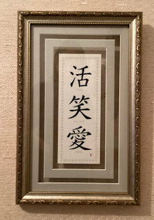 Asian ‘Live Laugh Love’ signed picture