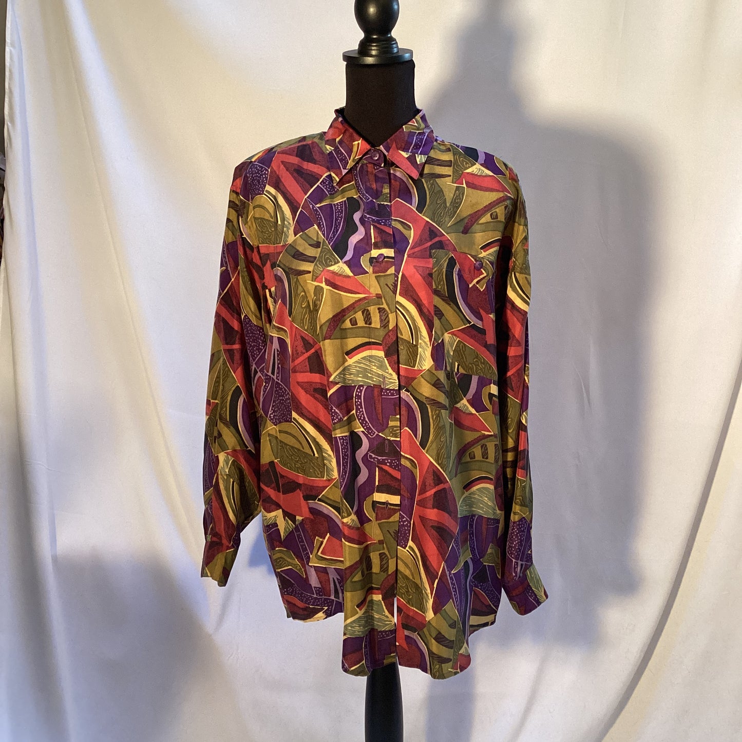 multicolored  100% silk blouse with buttons by Stint Collections. Size medium. Colors brown, green, blue